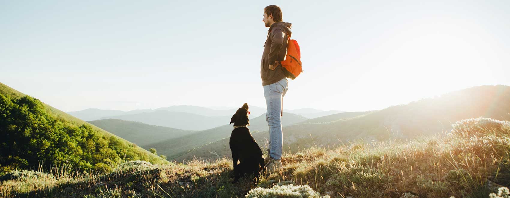 man outdoors with dog